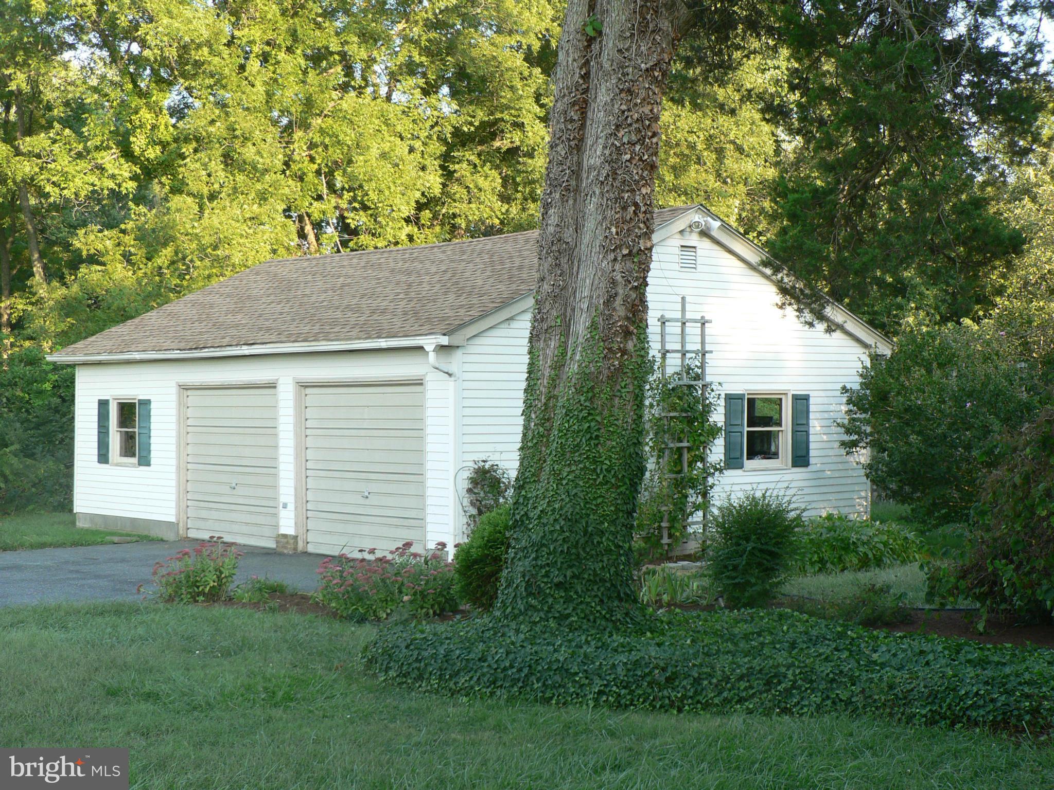 7041 Thorneton Road St. Michaels, MD 21663 - Photo 16 of 19 a house with trees in the background