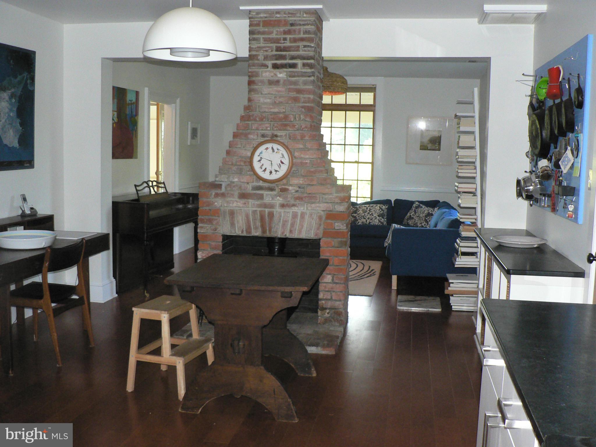 7041 Thorneton Road St. Michaels, MD 21663 - Photo 10 of 19 a living room with furniture and a fireplace