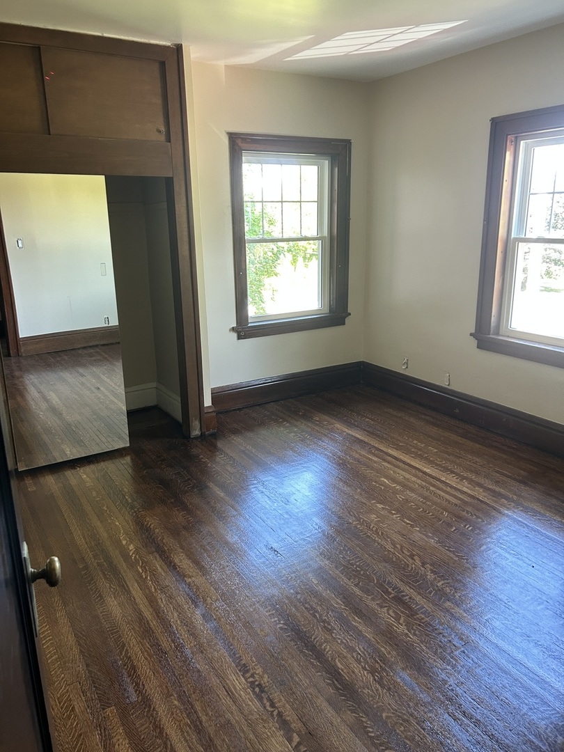 200 East Dakota Street Spring Valley, IL 61362 - Photo 21 of 23 an empty room with wooden floor and windows