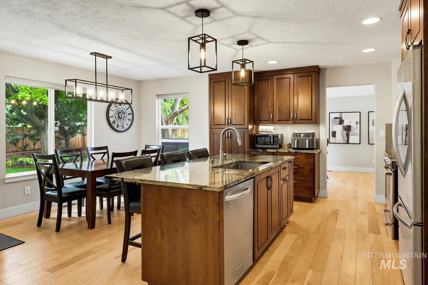369 South Winthrop Way Boise, ID 83709 - Photo 13 of 50 Kitchen with wood-finish flooring, recessed lighting, and stainless steel appliances