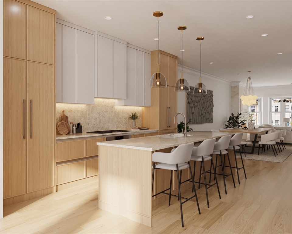 144 Worcester Street, Unit 3 Boston, MA 02118 - Photo 3 of 15 a kitchen with a table chairs and white appliances