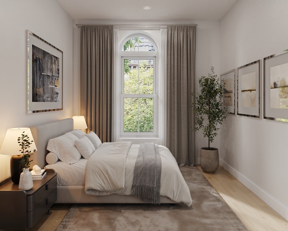 144 Worcester Street, Unit 3 Boston, MA 02118 - Photo 9 of 15 a bedroom with a bed and a window