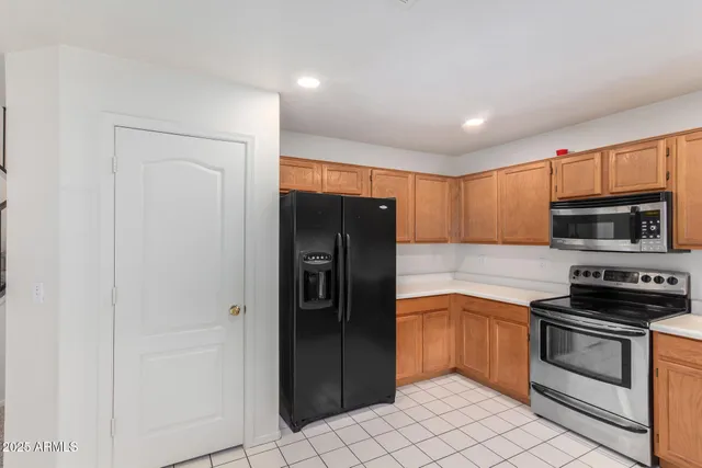 a view of a livingroom with furniture and an empty room