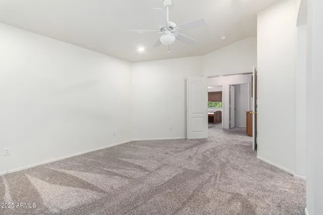 an empty room with windows and closet