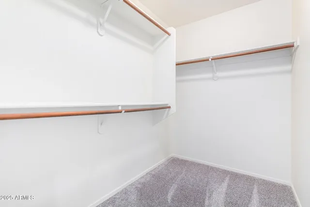 a bathroom with a sink double vanity granite tub shower and a mirror