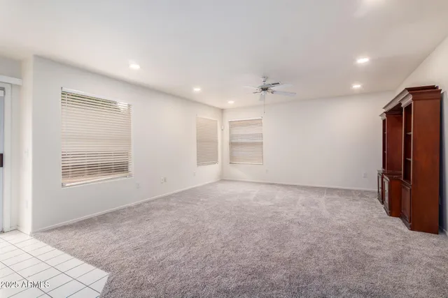 a large kitchen with kitchen island granite countertop a large counter top a sink stainless steel appliances and cabinets