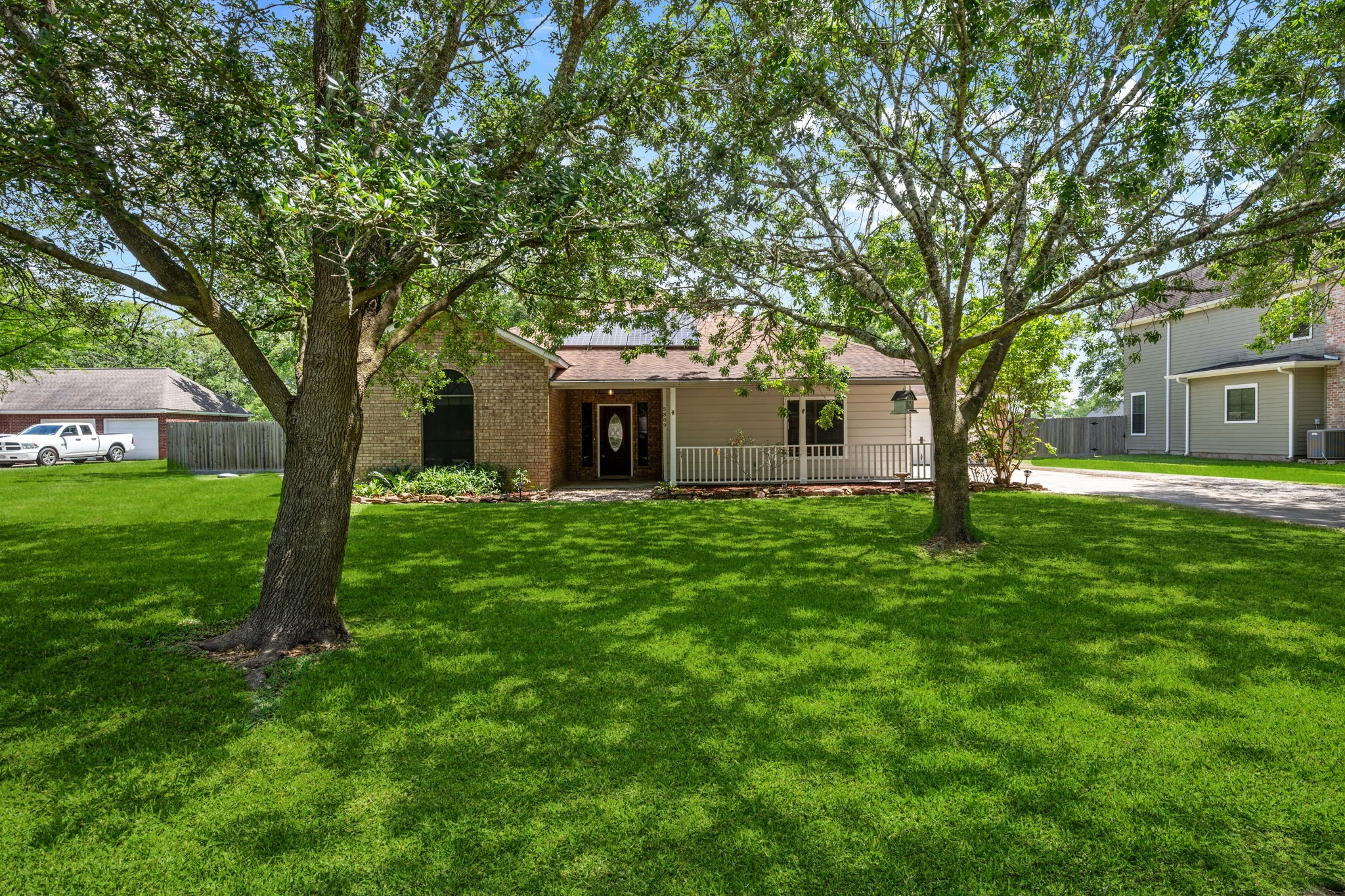 5809 Cajun Way Baytown, TX 77523 - Photo 1 of 29 a view of a house with backyard and a tree