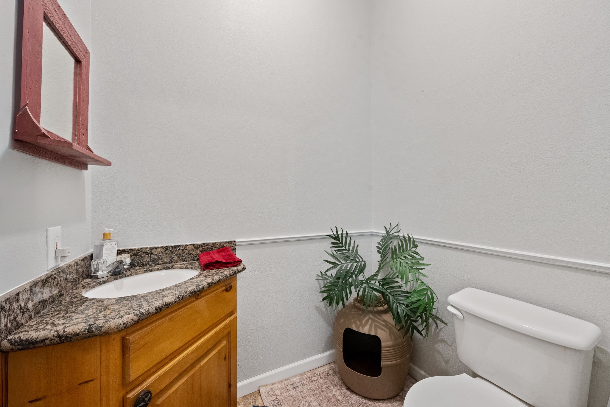 5809 Cajun Way Baytown, TX 77523 - Photo 18 of 29 a bathroom with a granite countertop sink and a mirror