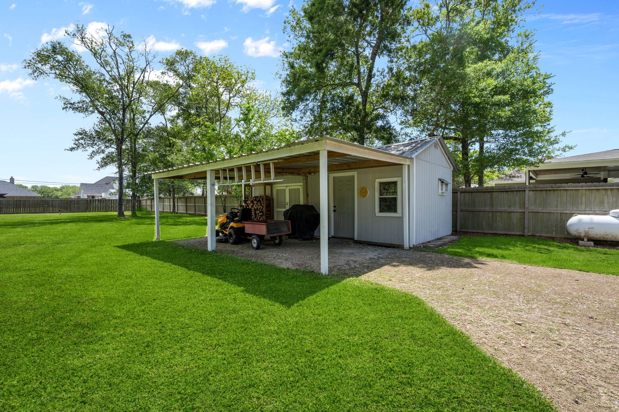 5809 Cajun Way Baytown, TX 77523 - Photo 25 of 29 a view of a chair and table in backyard of the house