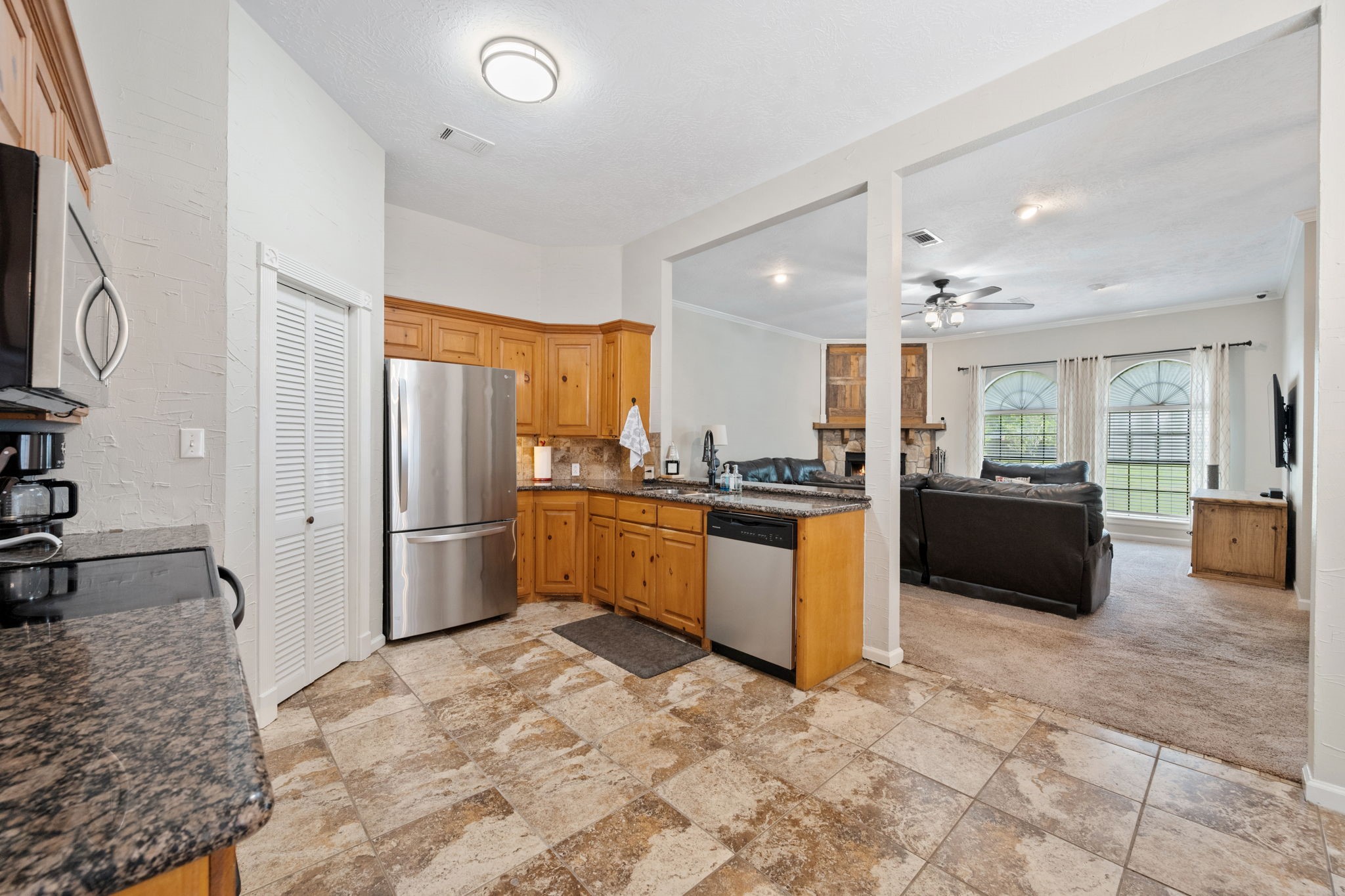 5809 Cajun Way Baytown, TX 77523 - Photo 9 of 29 a large white kitchen with a refrigerator and countertop