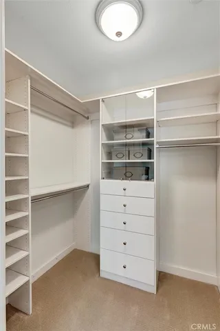 a bathroom with a toilet a sink and glass door