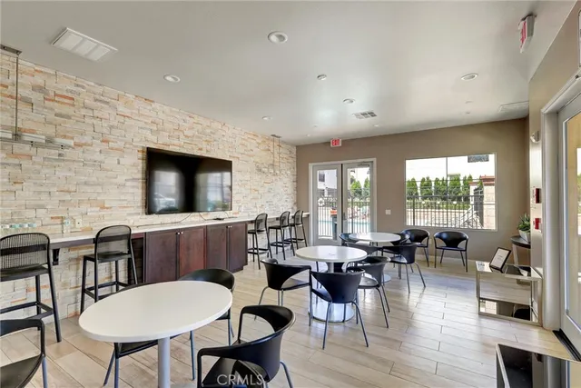 a view of a house with swimming pool and sitting area
