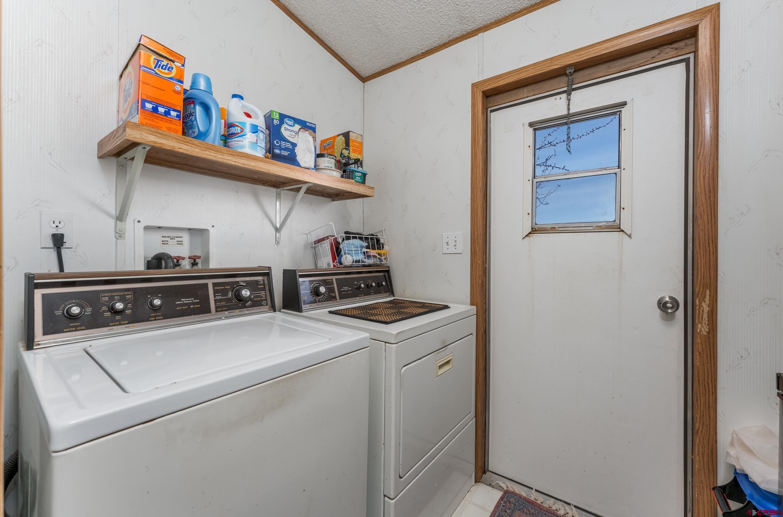 1837 Anna Road Ignacio, CO 81137 - Photo 15 of 32 a utility room with dryer washer and shoe rack