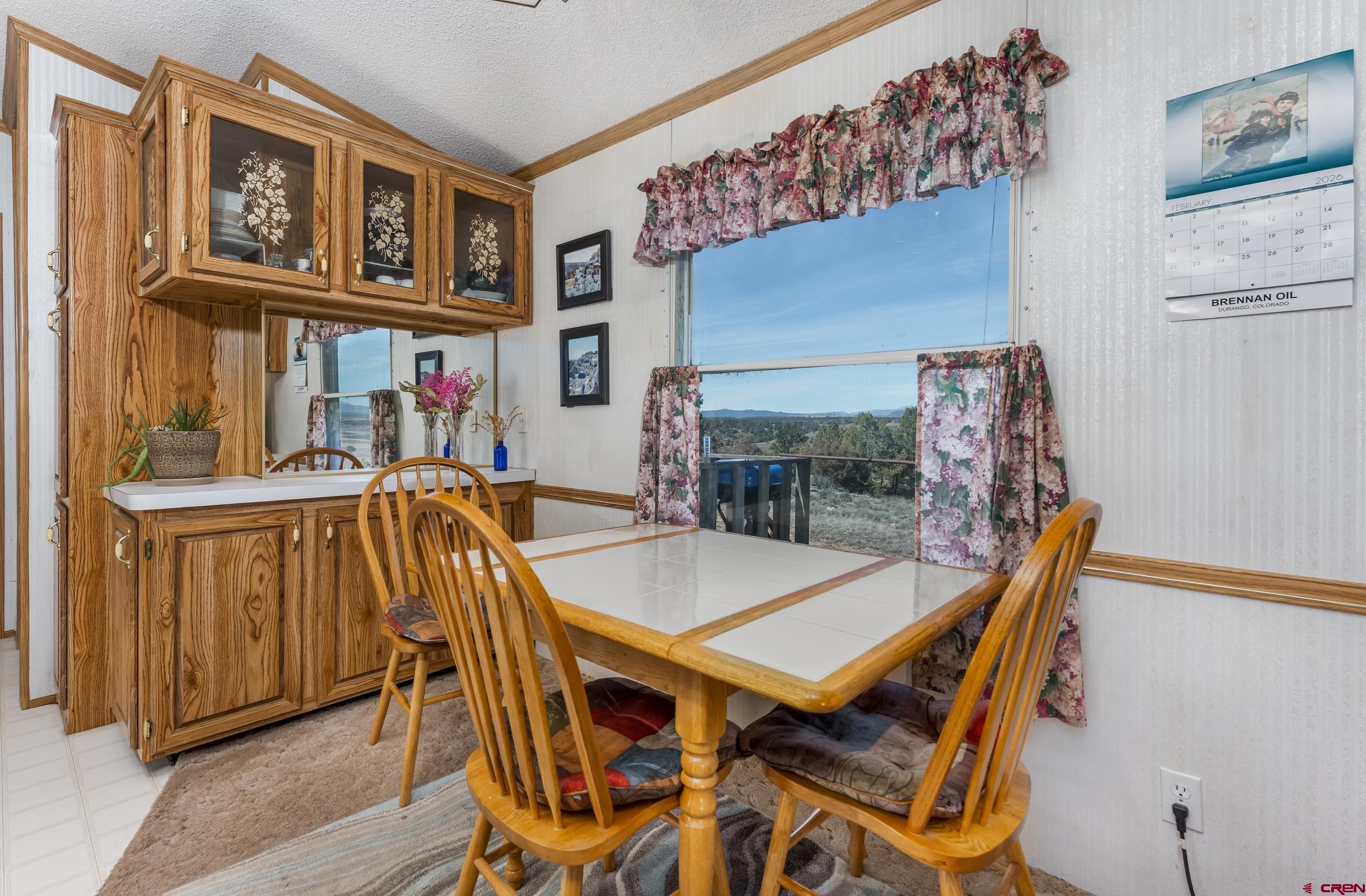1837 Anna Road Ignacio, CO 81137 - Photo 16 of 32 a dinning table and chairs in a room
