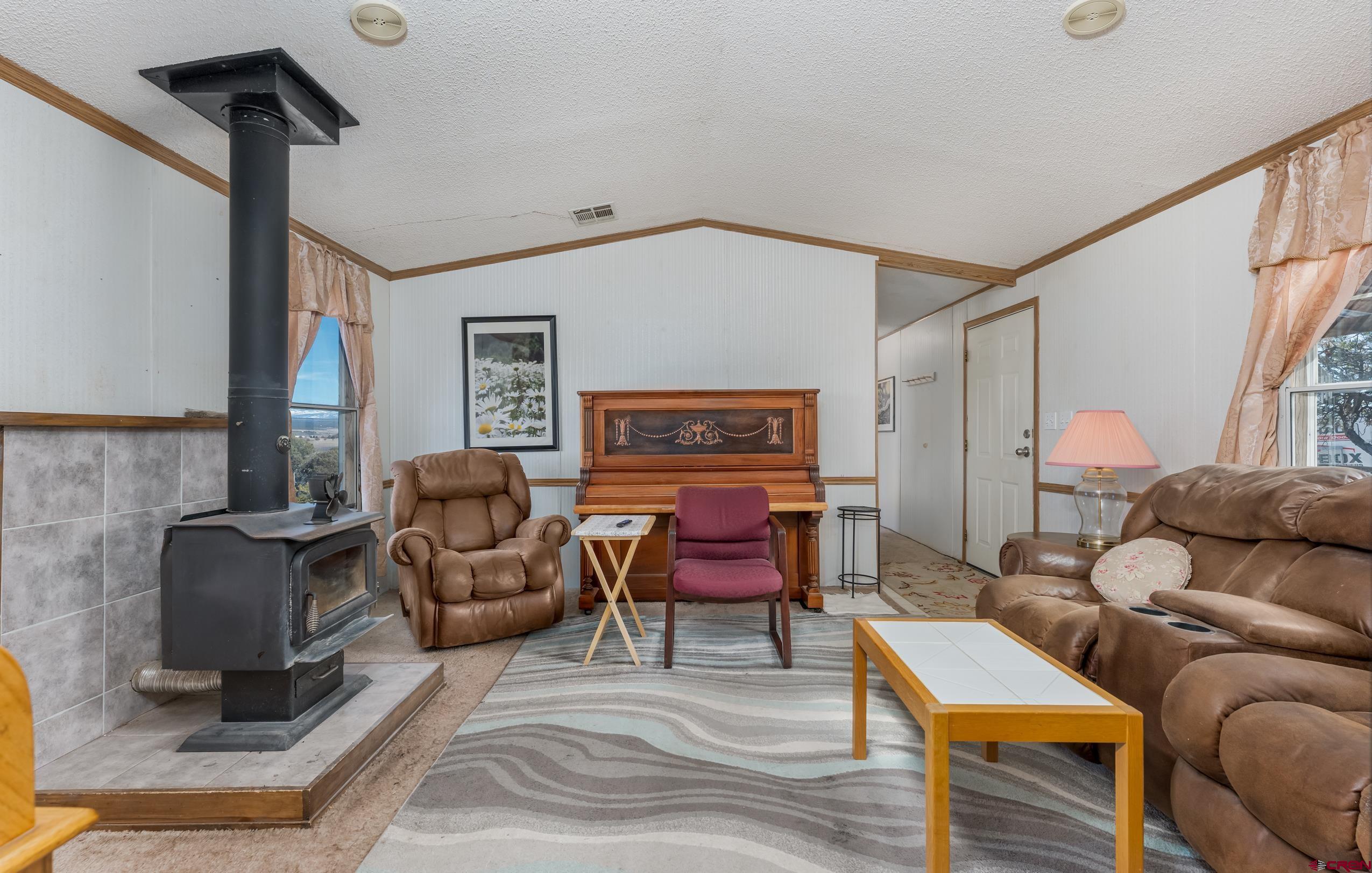 1837 Anna Road Ignacio, CO 81137 - Photo 21 of 32 a living room with furniture and a window