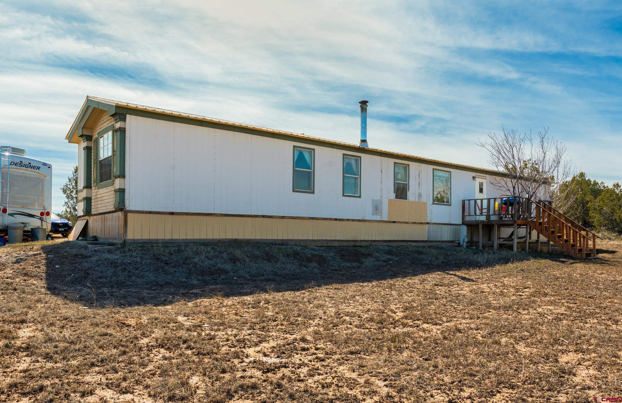 1837 Anna Road Ignacio, CO 81137 - Photo 29 of 32 a front view of a house with garden