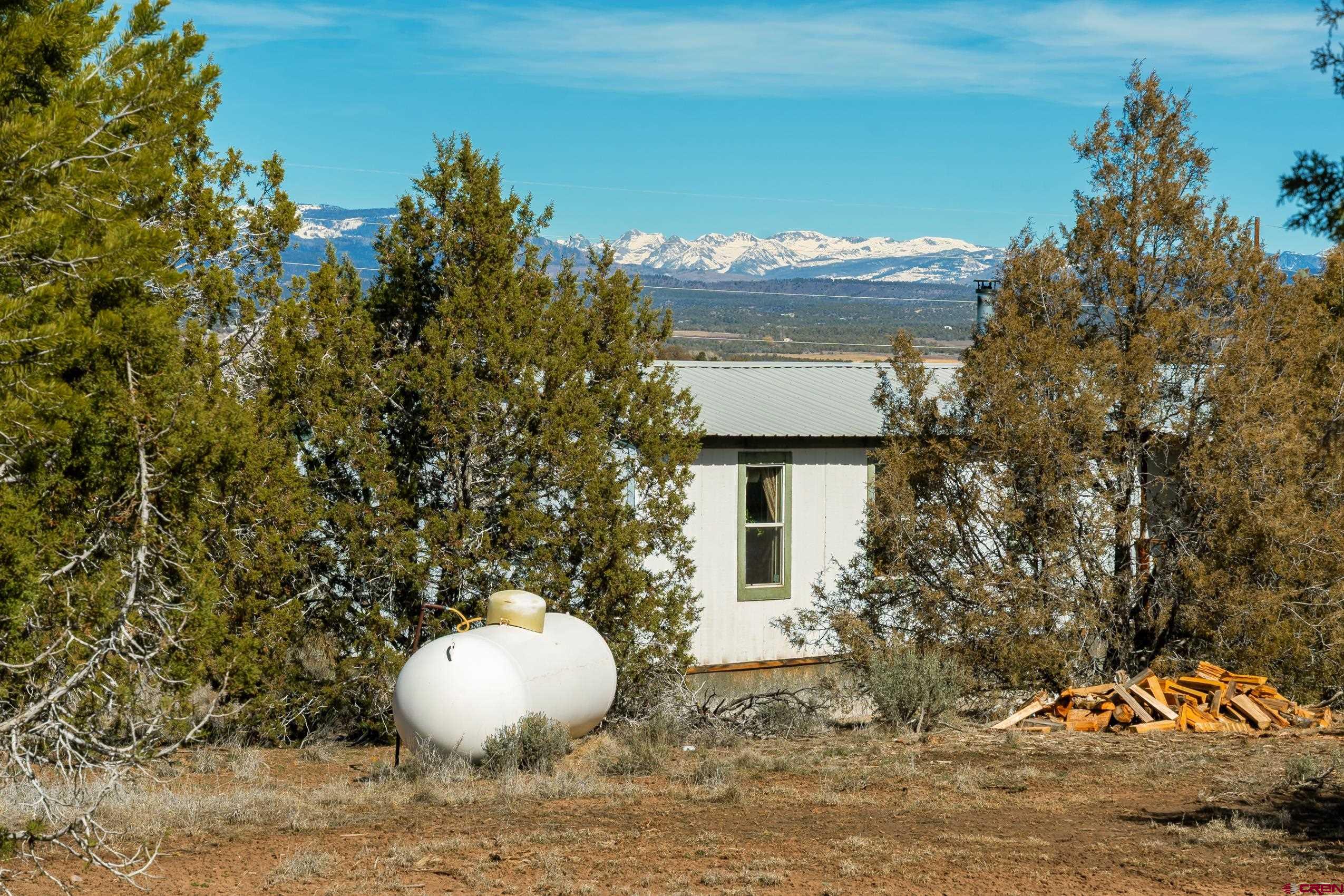 1837 Anna Road Ignacio, CO 81137 - Photo 3 of 32 a front view of a house with a yard