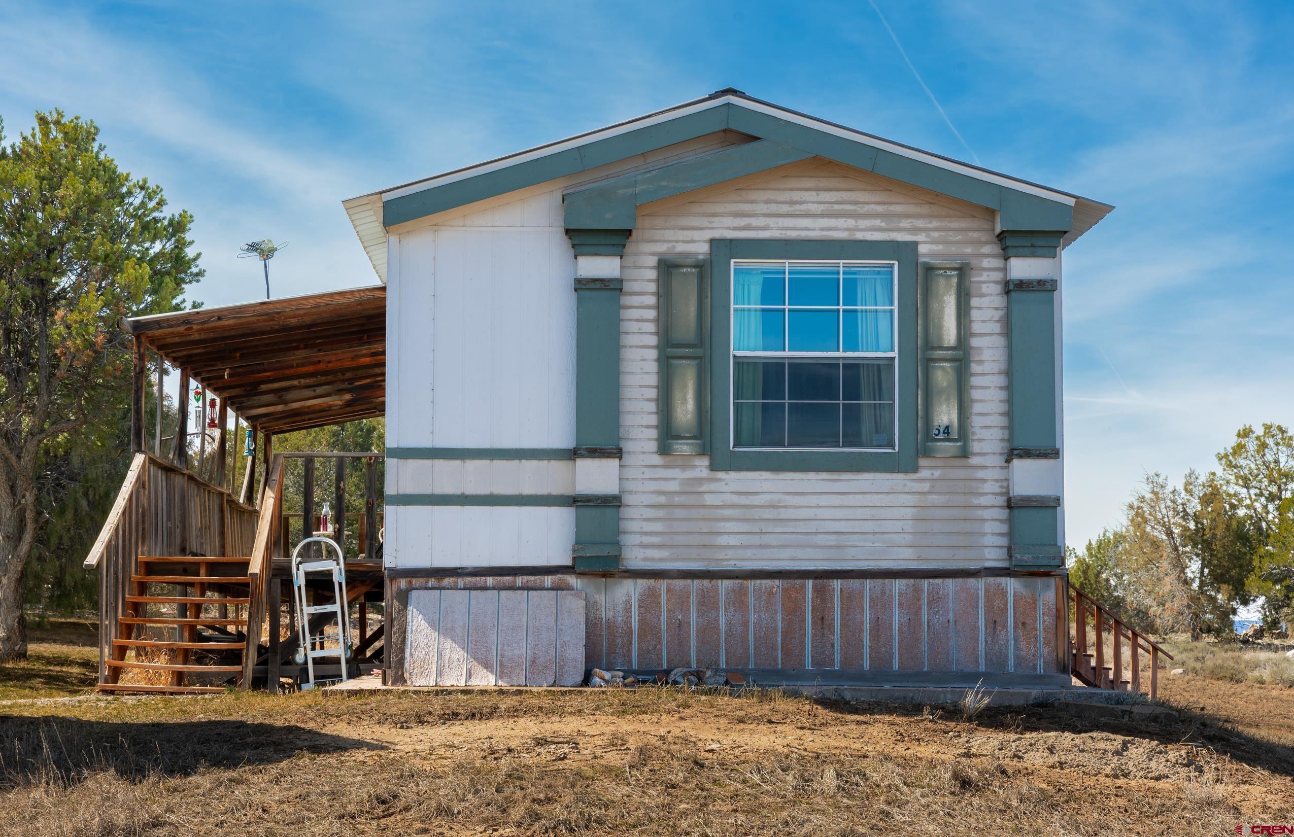 1837 Anna Road Ignacio, CO 81137 - Photo 31 of 32 a front view of a house with garden