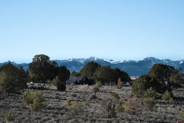 a view of a large building with a mountain in the background