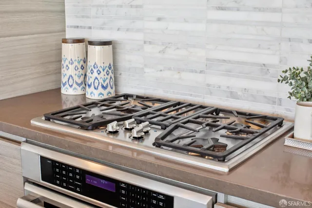 a balcony with furniture and a potted plant
