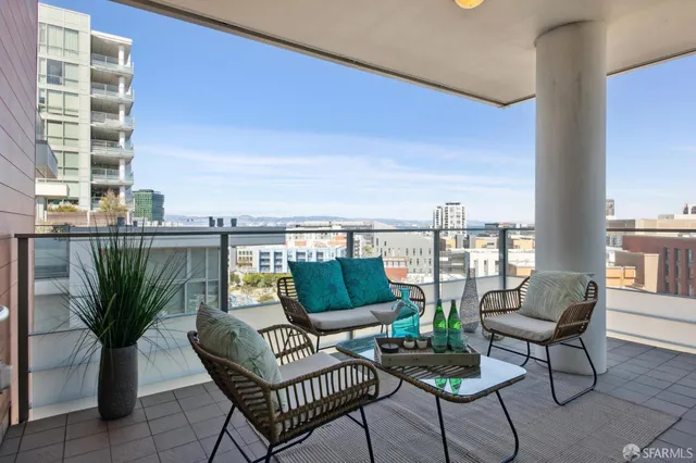 a bedroom with a bed and a view of kitchen