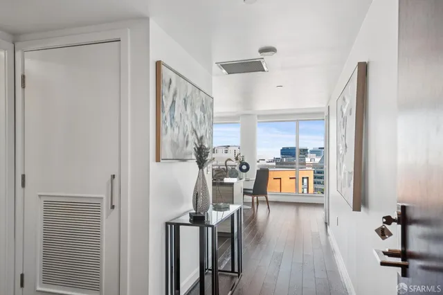 a view of a living room and hardwood floor
