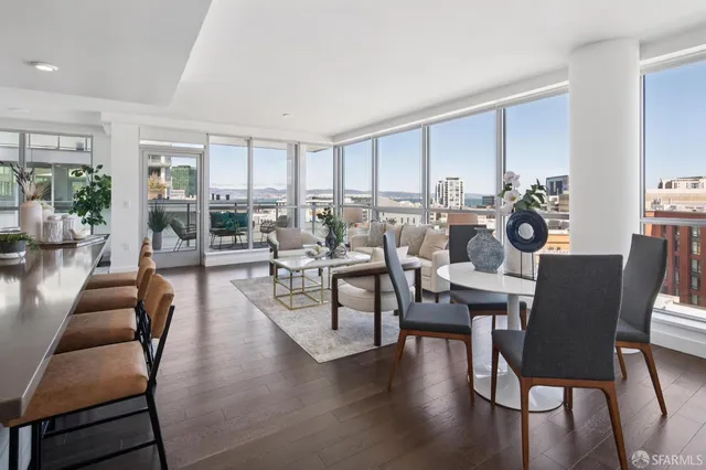 a view of a dining room with furniture window and wooden floor