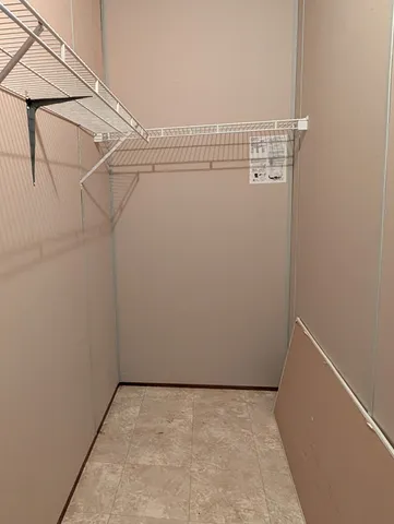 a view of a room with racks on the wall