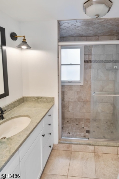 224 Swarthmore Road Linden, NJ 07036 - Photo 15 of 33 a bathroom with a granite countertop sink a mirror and shower