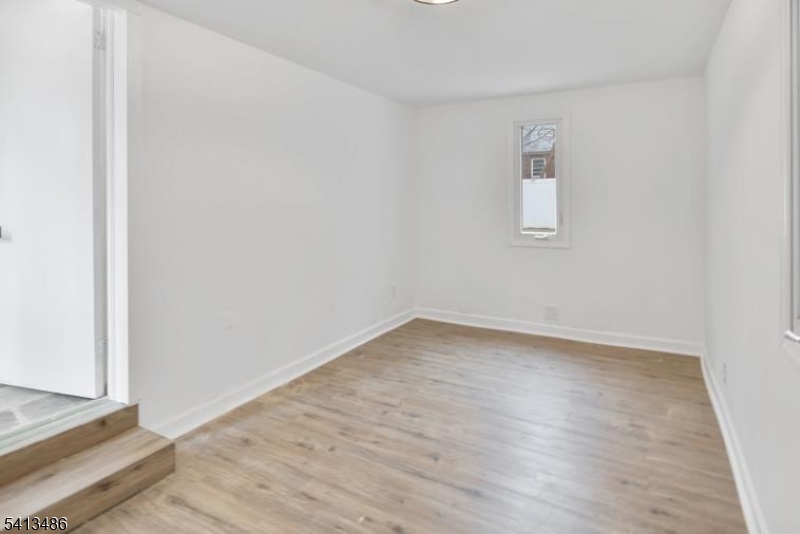 224 Swarthmore Road Linden, NJ 07036 - Photo 17 of 33 a view of a room that has wooden floor and a window