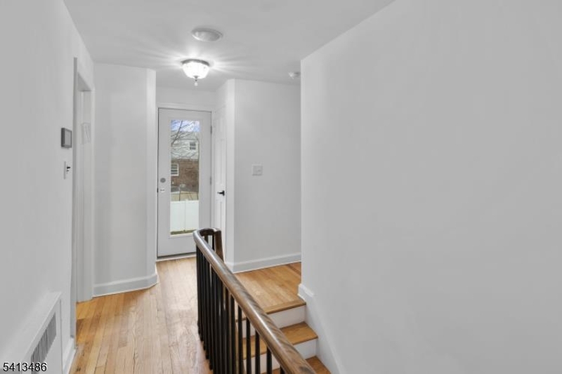 224 Swarthmore Road Linden, NJ 07036 - Photo 20 of 33 a view of a hallway with wooden floor and staircase