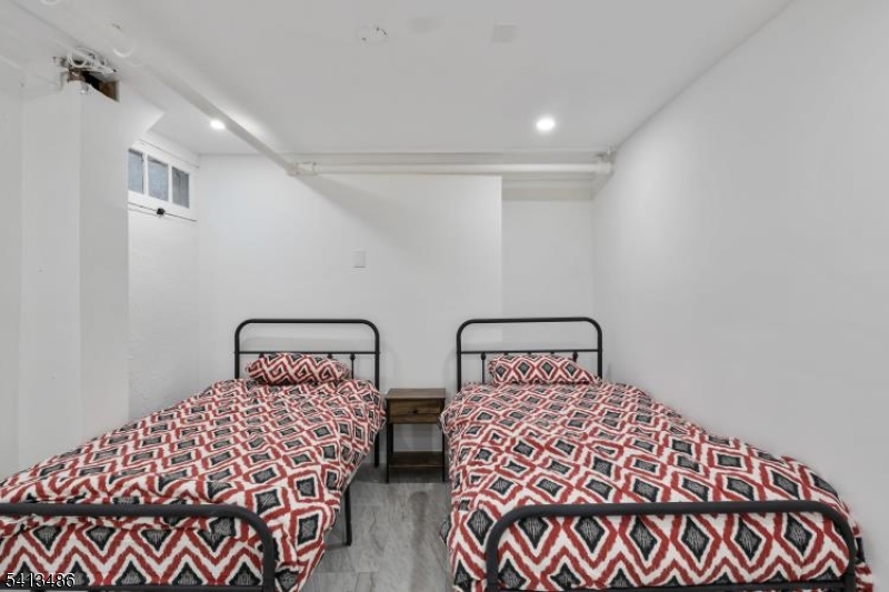 224 Swarthmore Road Linden, NJ 07036 - Photo 27 of 33 a bedroom with two beds and a lamp