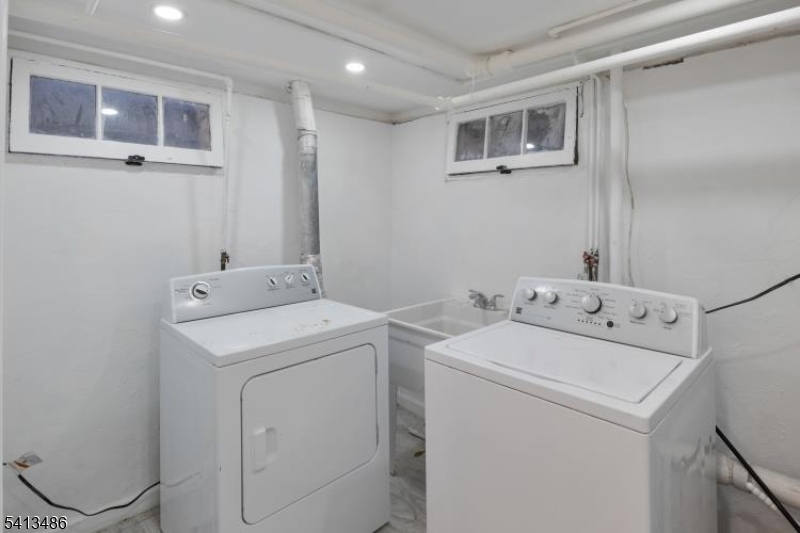224 Swarthmore Road Linden, NJ 07036 - Photo 29 of 33 a utility room with dryer and washer
