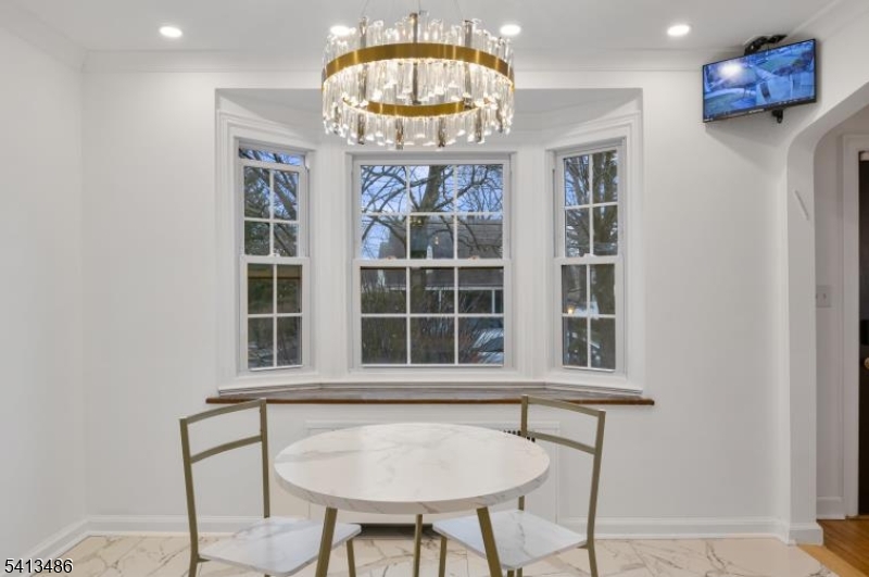 224 Swarthmore Road Linden, NJ 07036 - Photo 9 of 33 a view of an entryway with wooden floor and a chandelier