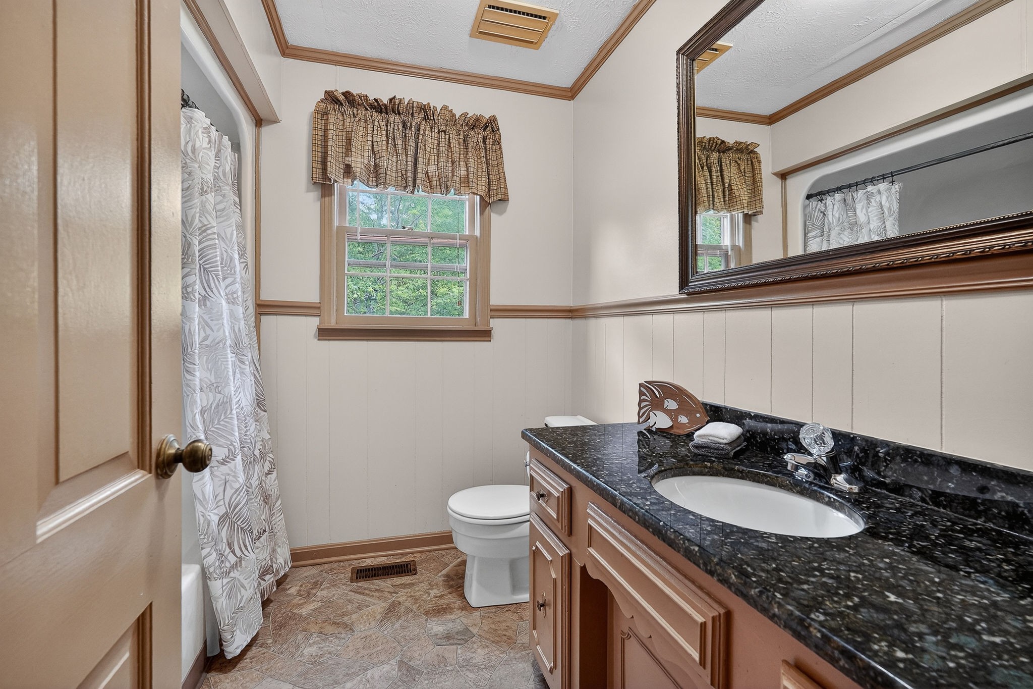 5642 Pates Ford Road Smithville, TN 37166 - Photo 15 of 32 a bathroom with a granite countertop sink toilet and mirror