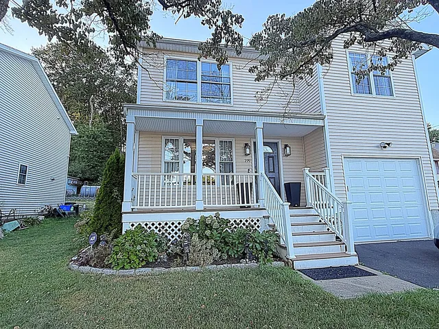a view of a house with a yard