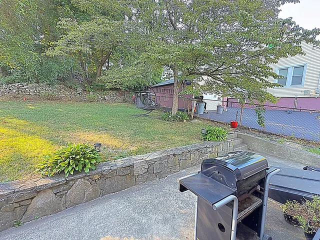 a view of a yard with furniture