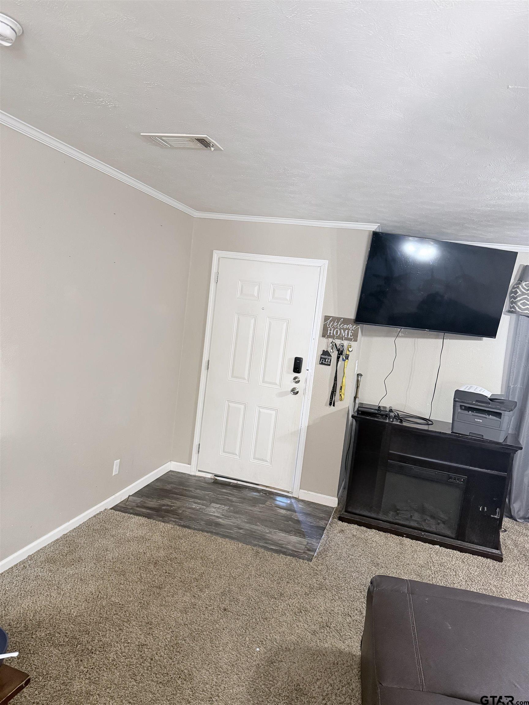 11300 Highway 271, Unit 52 Tyler, TX 75708 - Photo 7 of 16 a view of entryway with a flat screen tv