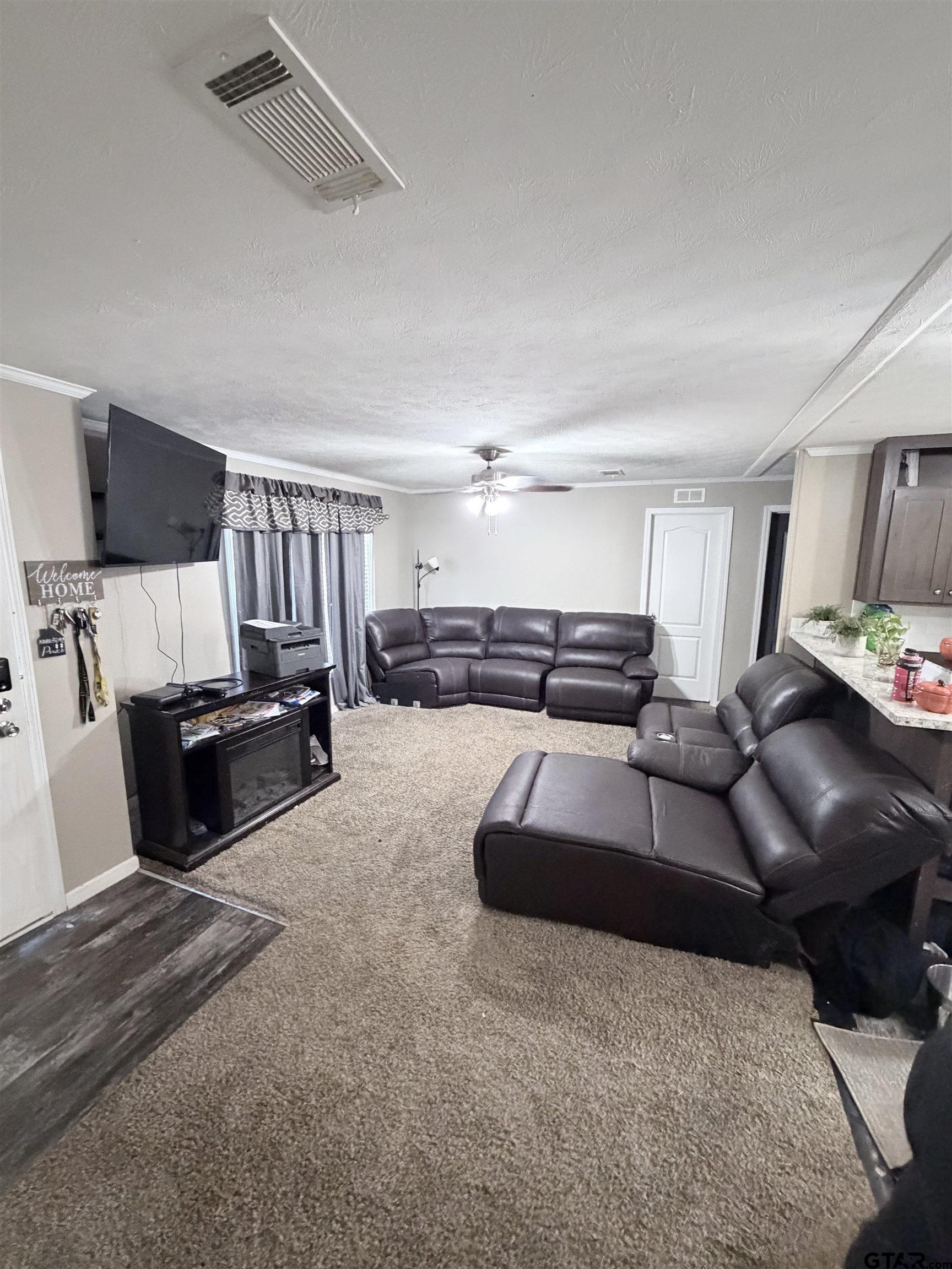 11300 Highway 271, Unit 52 Tyler, TX 75708 - Photo 8 of 16 a living room with furniture and a couch