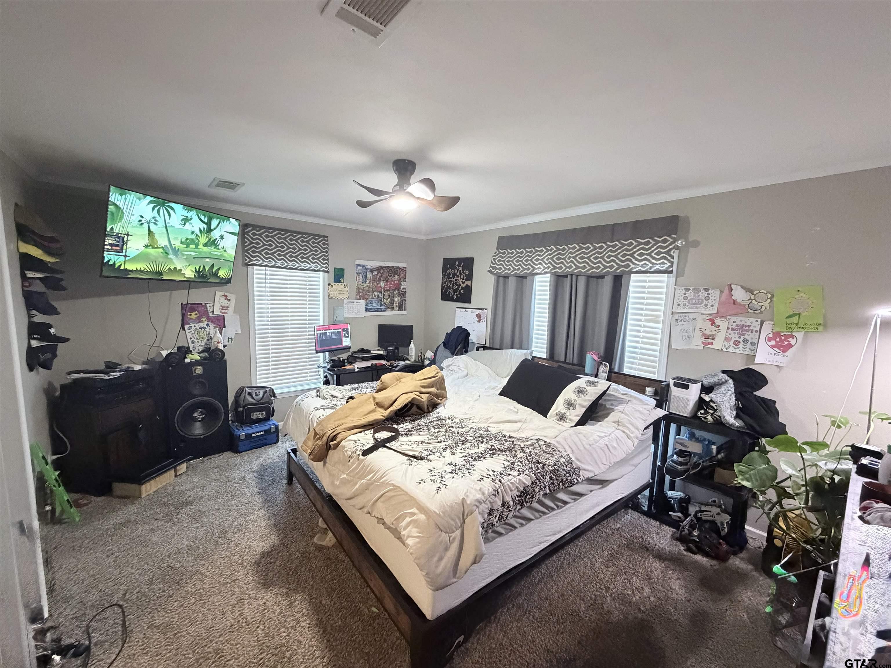 11300 Highway 271, Unit 52 Tyler, TX 75708 - Photo 10 of 16 a bed room with a bed window and a chair