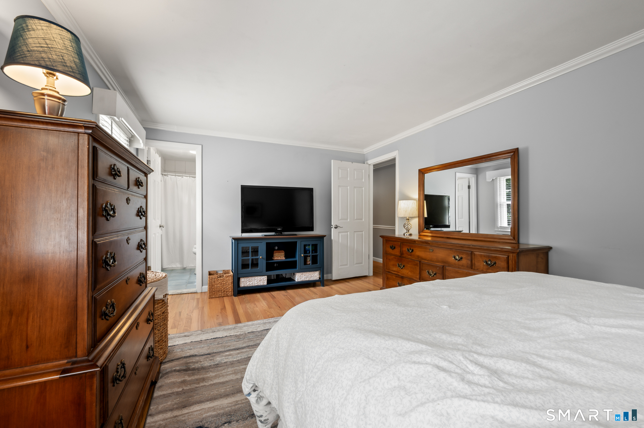 1611 Shepard Avenue Hamden, CT 06518 - Photo 19 of 31 a bedroom with a bed and a flat screen tv