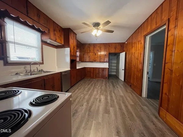 a kitchen with a stove and a refrigerator