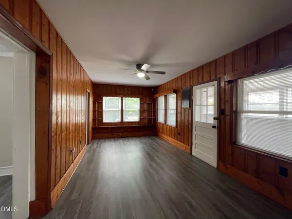 a view of hallway with wooden floor