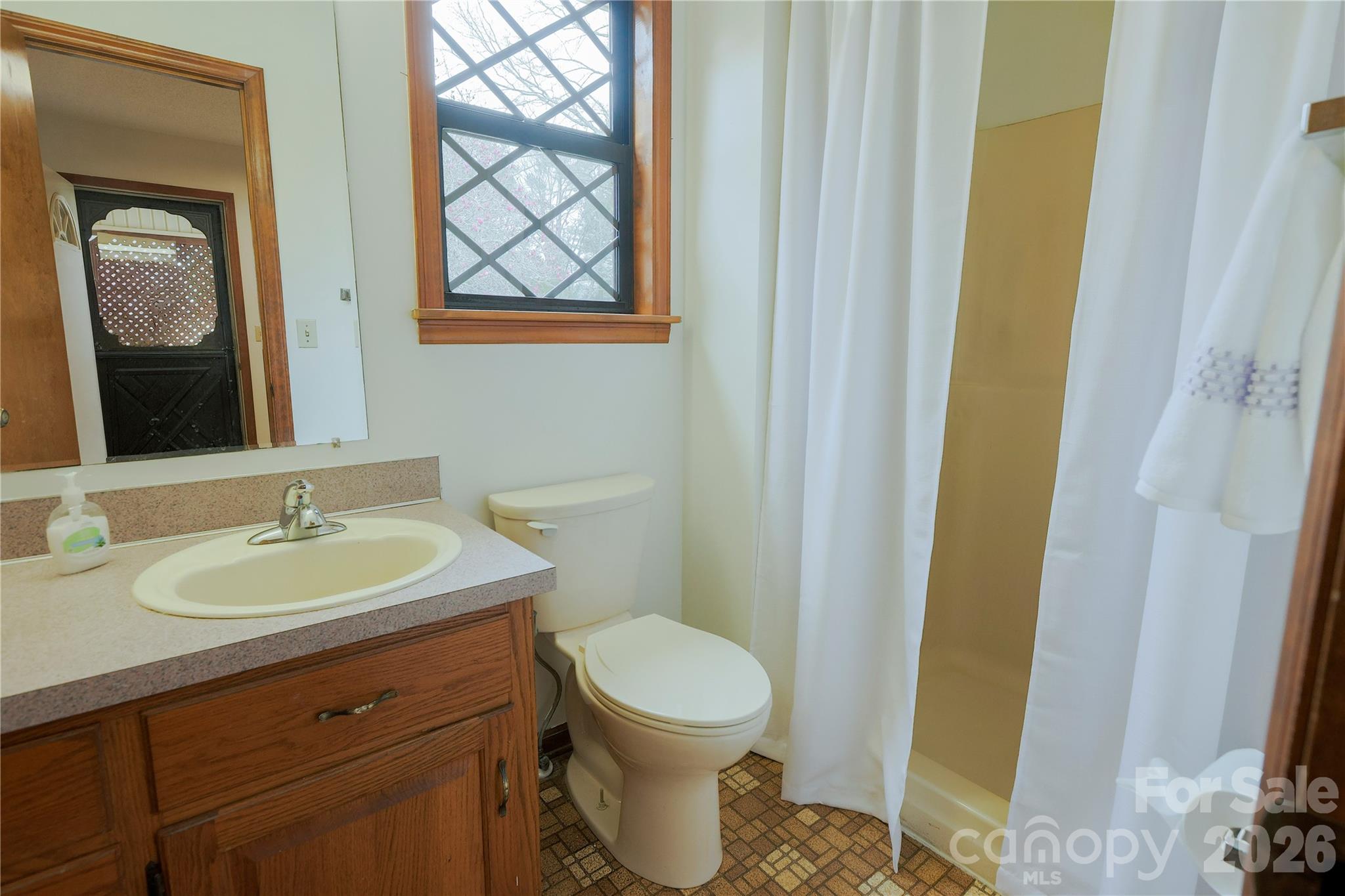11237 Old Concord Road Rockwell, NC 28138 - Photo 11 of 30 a bathroom with a toilet sink and mirror