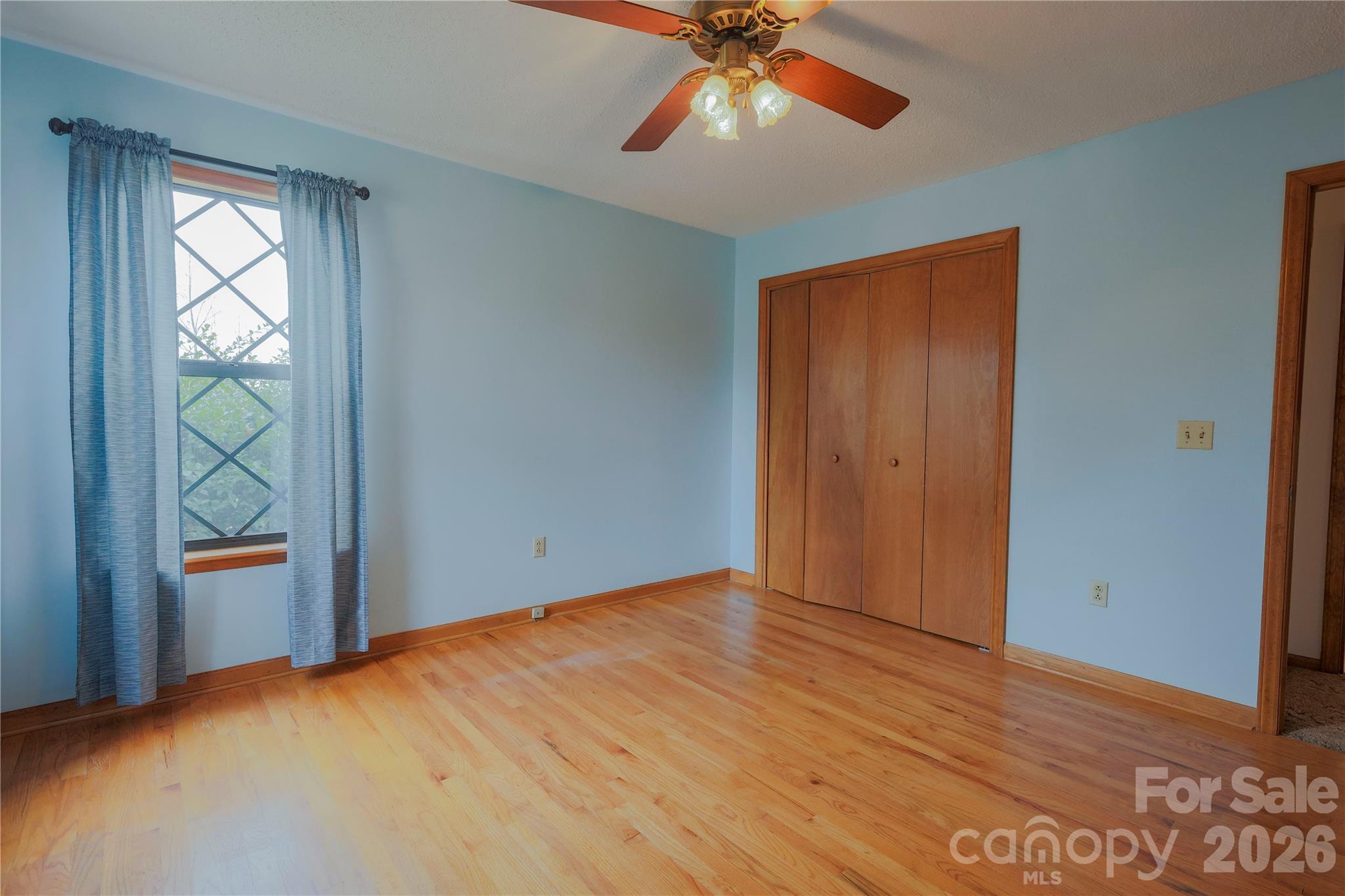 11237 Old Concord Road Rockwell, NC 28138 - Photo 19 of 30 a view of an empty room with window and wooden floor