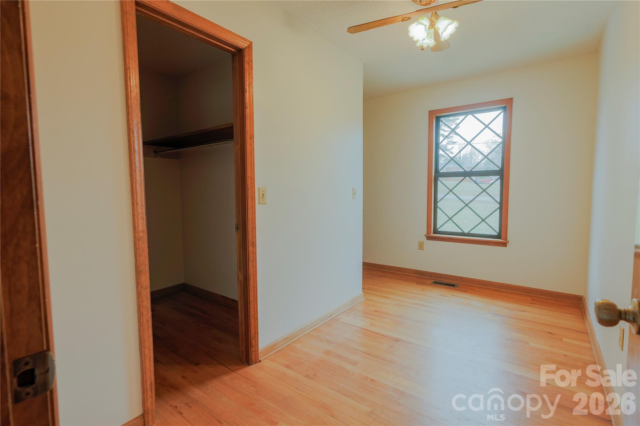 11237 Old Concord Road Rockwell, NC 28138 - Photo 20 of 30 a view of an empty room with wooden floor and a window