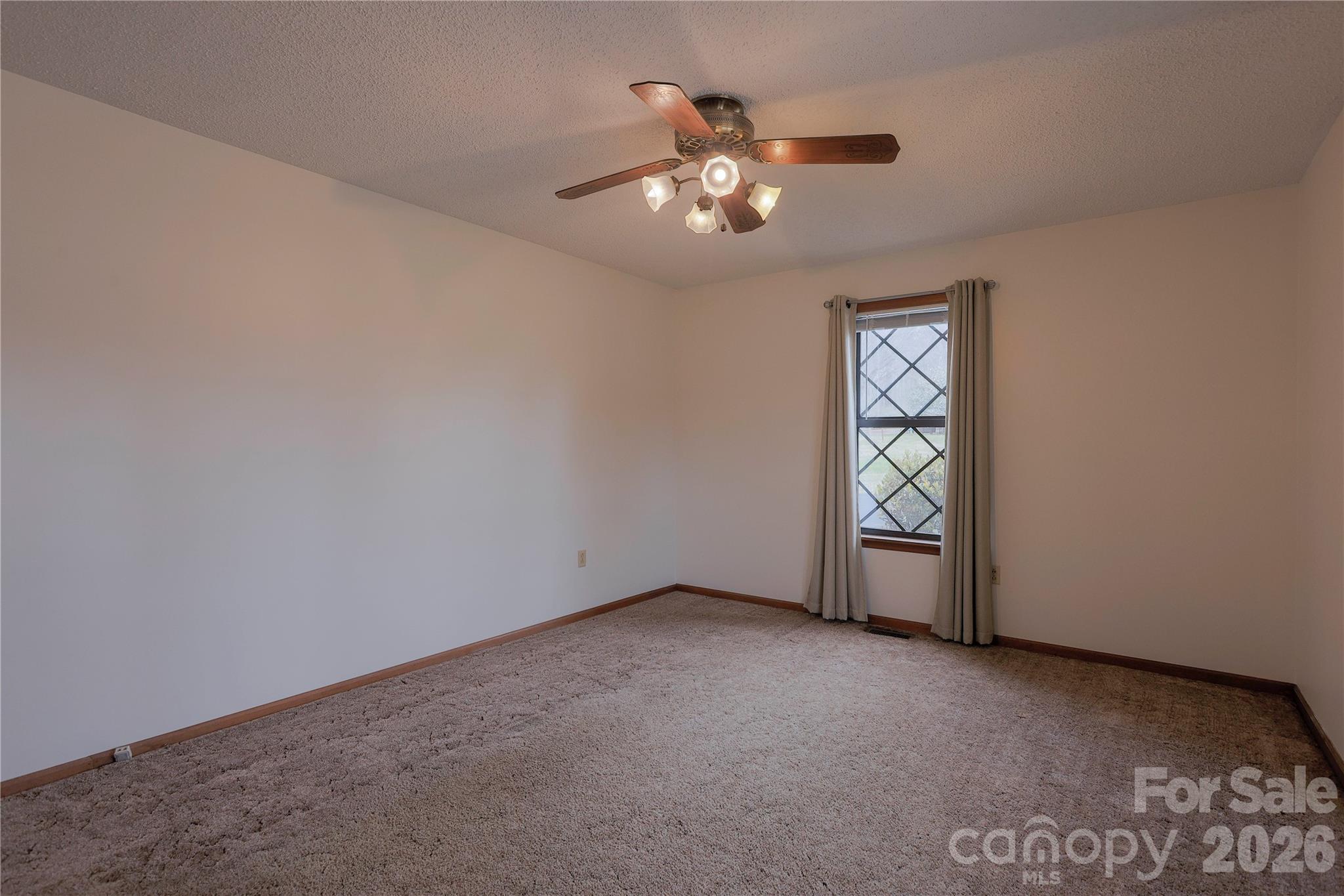 11237 Old Concord Road Rockwell, NC 28138 - Photo 4 of 30 a view of an empty room with a chandelier fan