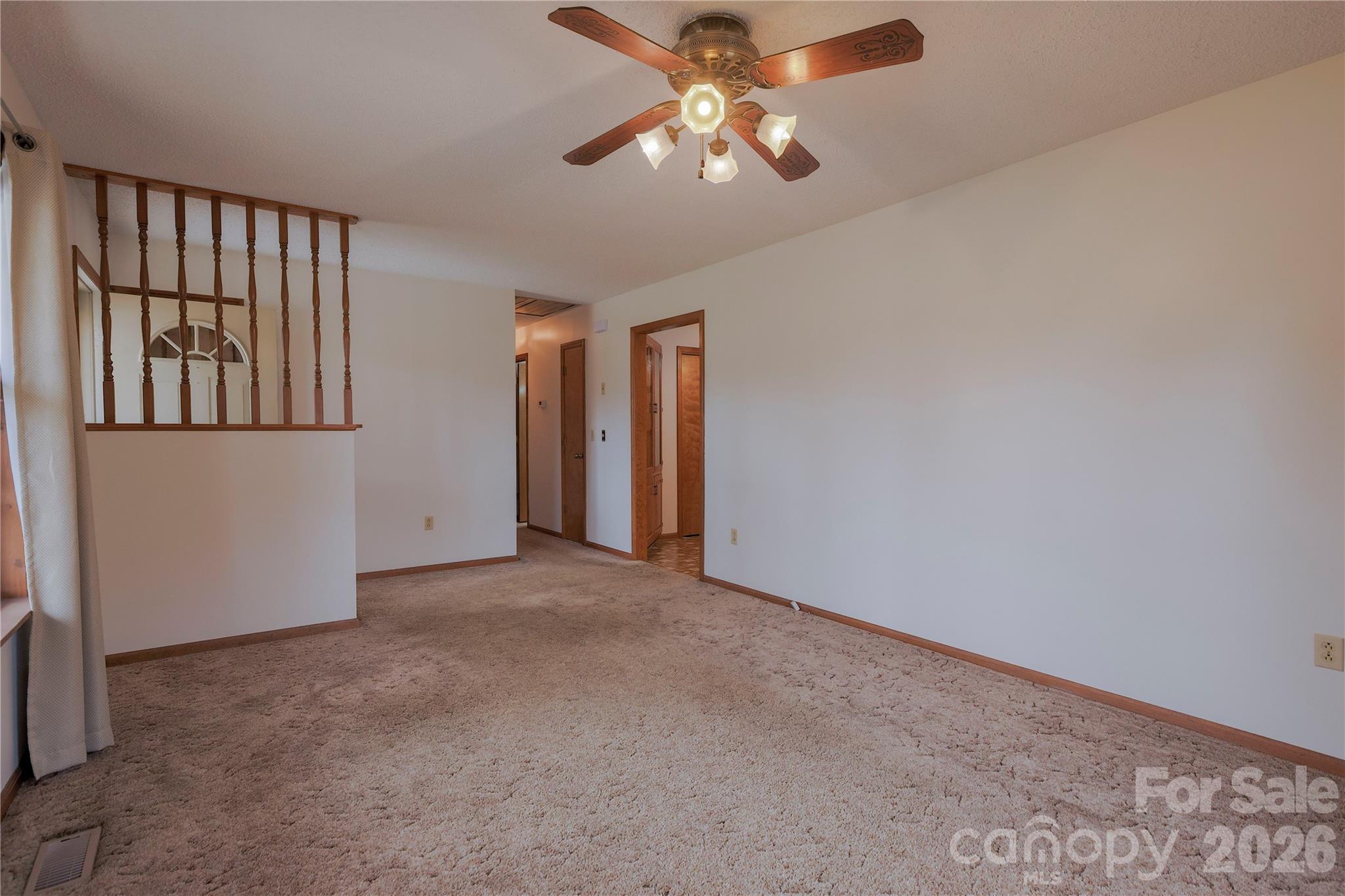11237 Old Concord Road Rockwell, NC 28138 - Photo 6 of 30 an empty room with chandelier fan