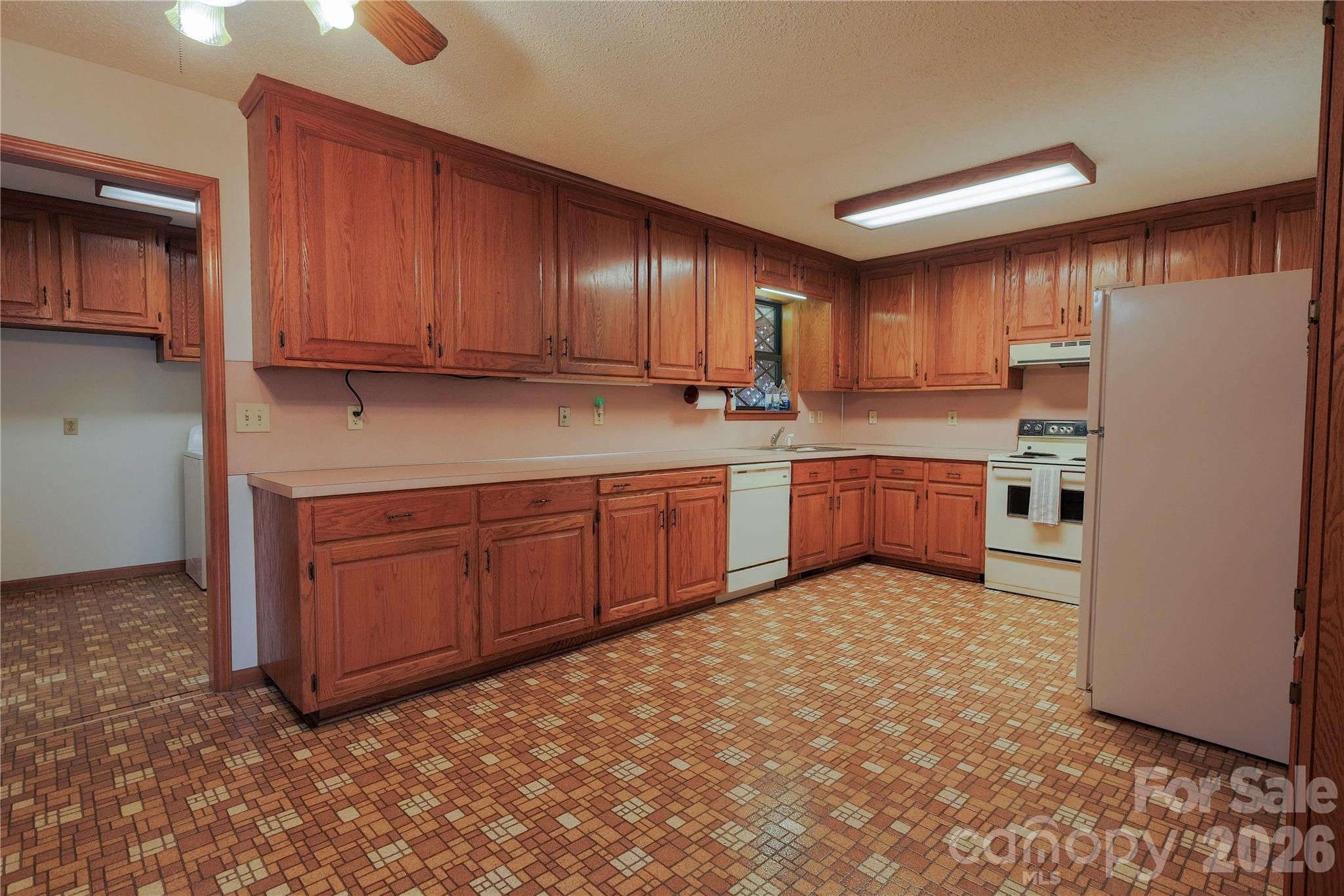 11237 Old Concord Road Rockwell, NC 28138 - Photo 7 of 30 a kitchen with stainless steel appliances granite countertop a refrigerator sink and cabinets