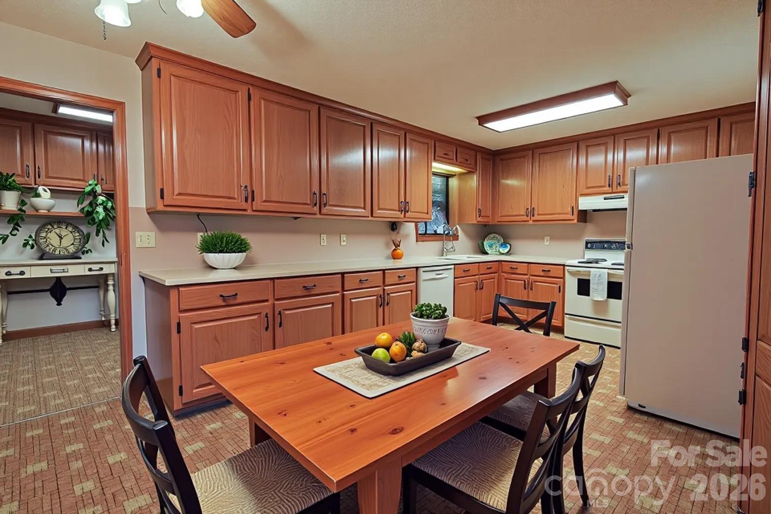11237 Old Concord Road Rockwell, NC 28138 - Photo 8 of 30 a kitchen with a sink refrigerator and cabinets